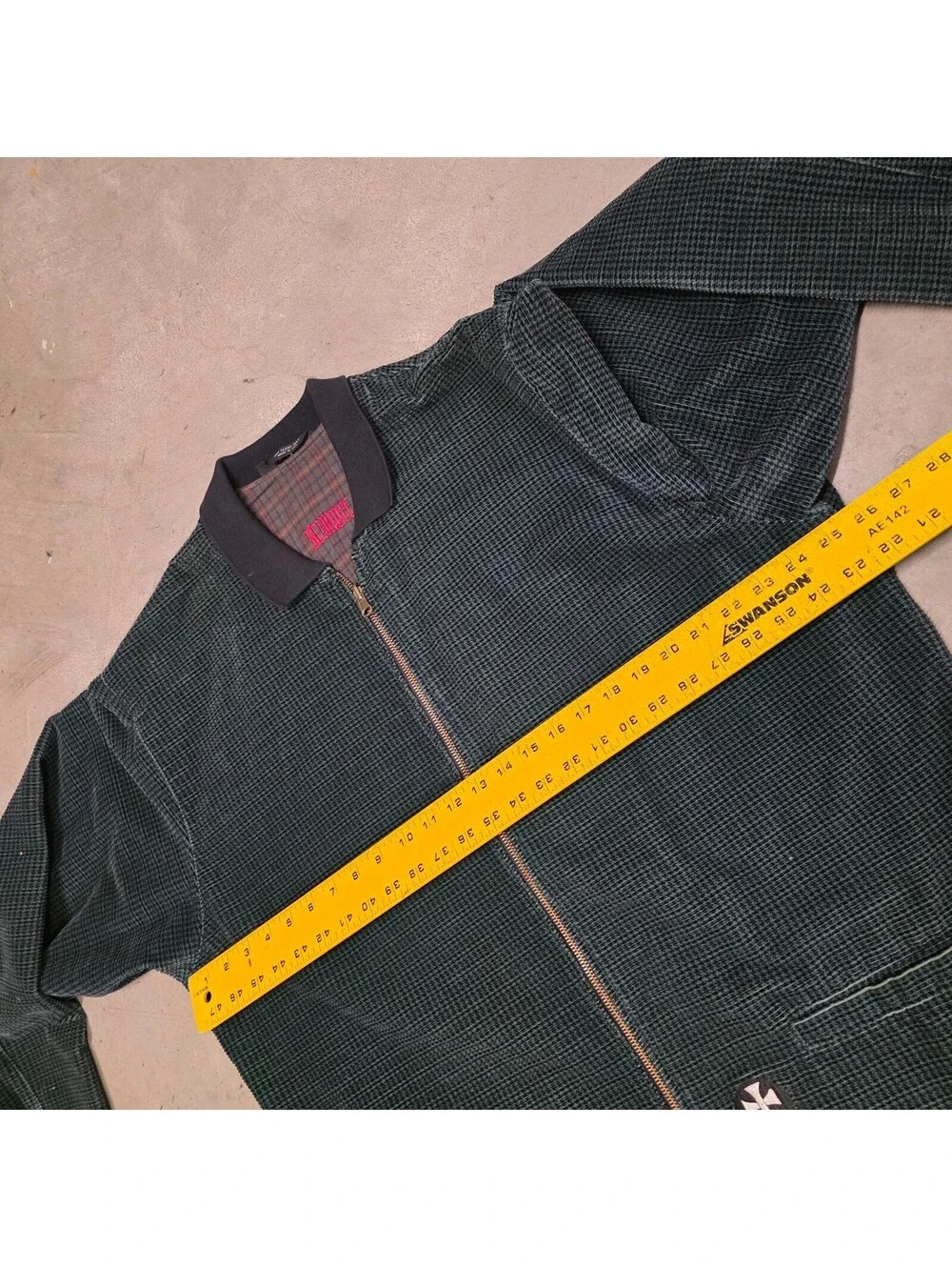 Schroff corduroy jacket features a distinctive green checkered pattern 25x34